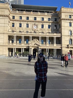 author standing in front of historic building