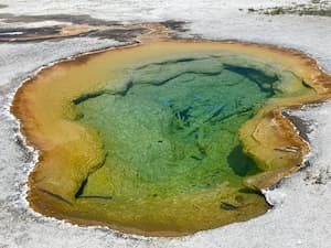 a teal and orange hot spring